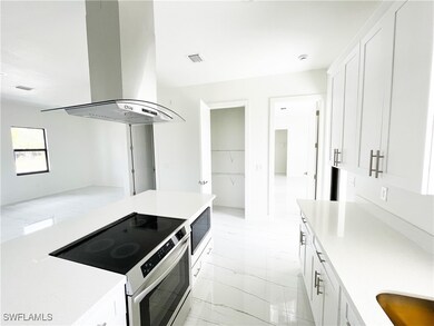 Kitchen with appliances with stainless steel finis