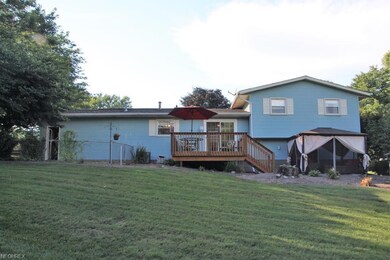 Backyard features fenced-in pet area, deck and gazebo!