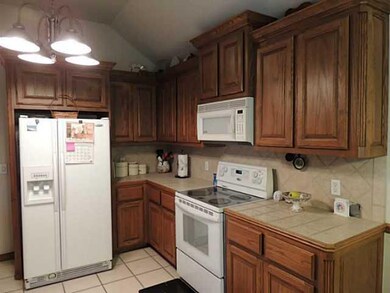 Kitchen. Kitchen features electric range, built-in