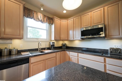 Kitchen on Main Floor. Overlooks back yard and lake.