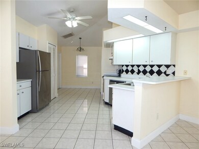 Kitchen with freestanding refrigerator, decorative