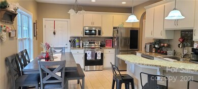 Kitchen with Granite Countertops and new Appliances. Access to Garage