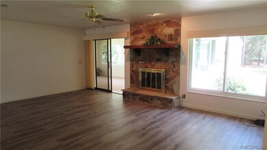 living room with new laminate flooring, slider to