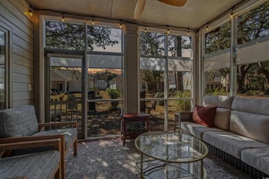 Sunroom featuring ceiling fan