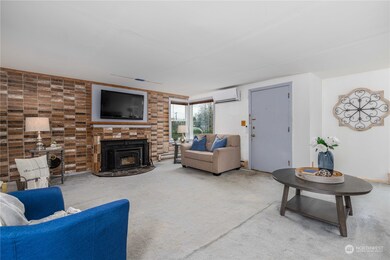 Living room is huge with newer wood burning fireplace