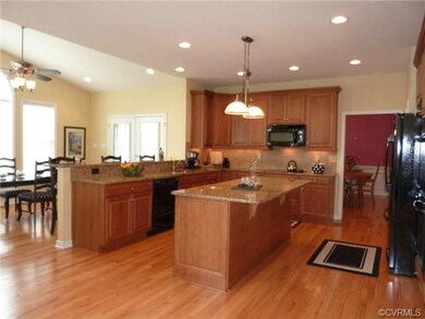 Gourmet kitchen complete with double ovens, refrig