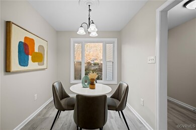 Dining room with hardwood / wood-style flooring an