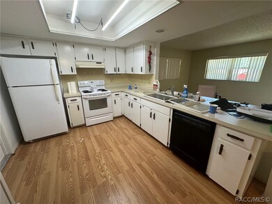 Kitchen overlooks the family room with bar seating