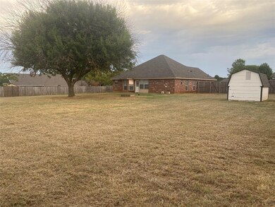 View of yard featuring a storage shed