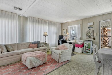 Living Room w/wall to wall windows