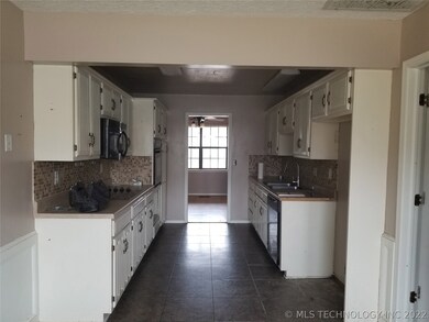 view of kitchen and dining room from the breakfast