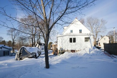 Rear exterior view with basement door