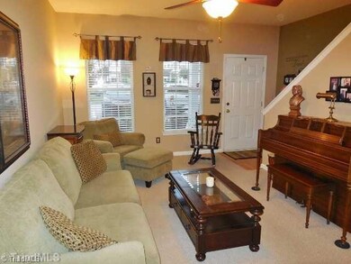 Living Room. Nine foot ceilings create an open feeling in the entire downstairs. A pleasant color palette enhance every room and the two large front windows enable lots of natural light to flow in.