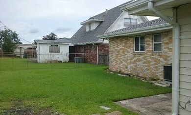 Rear View of Property and Backyard