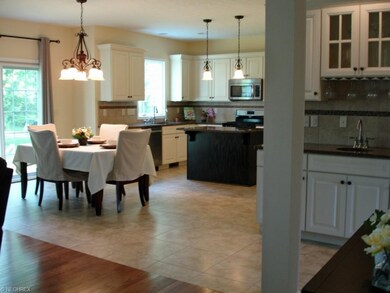 Upgraded cabinets with accent lighting,  granite c