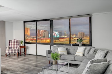 Living area featuring a city view and wood finishe