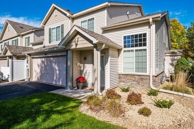 View of front yard landscaping toward driveway and