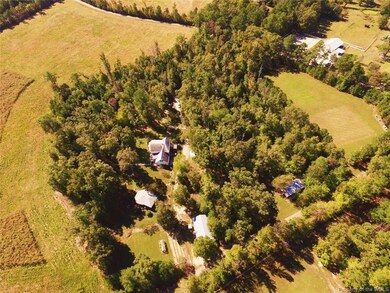 Property boundary is approx the wooded part and pasture to right.  Monticello Ave is the top left corner of picture