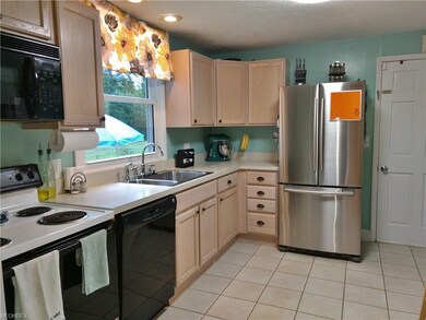 Remodeled kitchen with ceramic flooring. The appli