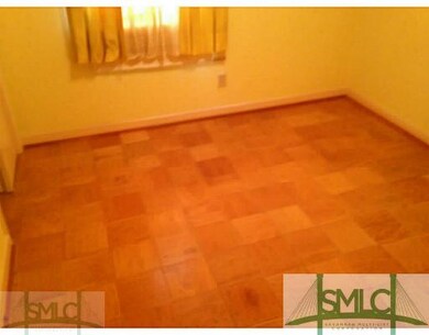 Bedroom. All parquet flooring through out home.  N