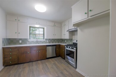 UPDATED KITCHEN WITH NEW QUARTZ, APPLIANCES, AND T
