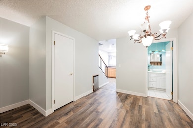 Unfurnished dining area featuring stairway, wood f