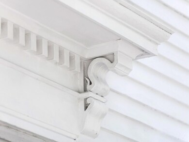 ... adorned with carved trim work.