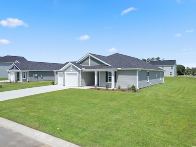 Ranch-style house featuring a garage and a front l
