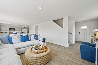 Living room with light hardwood / wood-style floor