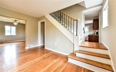 Spacious entry with split staircase.