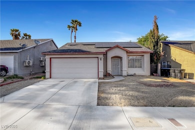 Ranch-style home featuring an attached garage, dri