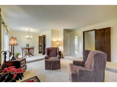 Cozy main level living room with wood burning fire