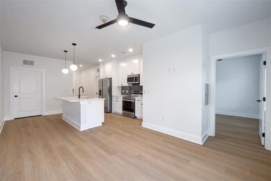 Kitchen with stainless steel appliances, a sink, 