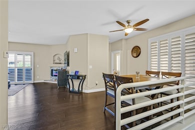 Dining space with a ceiling fan, wood finished flo