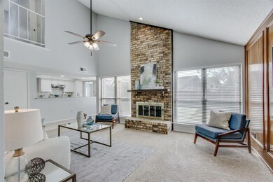Spacious living room with big windows to let in th