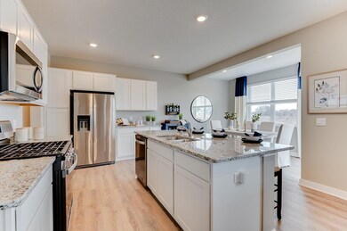 Large kitchen island, stainless appliances, ample cabinet space all compliment this chef's dream. *Staged Model photo, actual selections and options may vary.