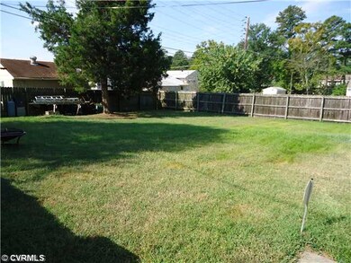 Exterior Back - fenced in back yard with privacy f
