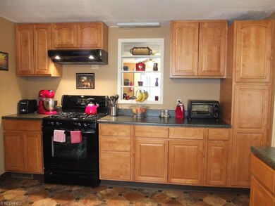 Another view of the kitchen with lots of cabinet s