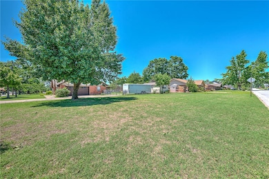 Large side yard next to house. Level lot totaling