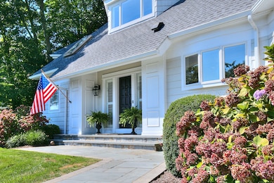 Blue stone stairs and front walkway with gorgeous hydrangeas nestled in to greet you.
