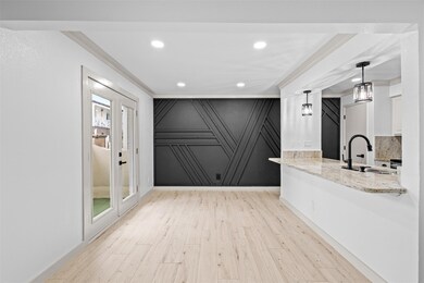 Unfurnished room with ornamental molding, light ha