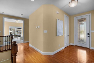 Entry foyer with tall ceilings and 8 ft doors