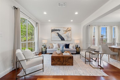 Living area with wood finished floors, baseboards