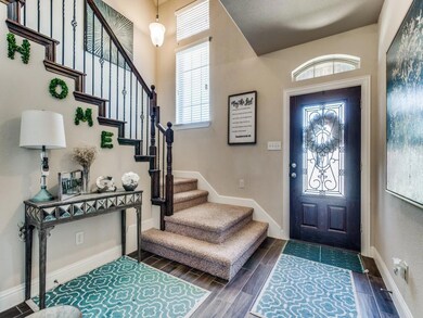 Foyer features majestic staircase!