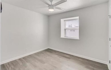 Unfurnished room featuring wood-type flooring and 
