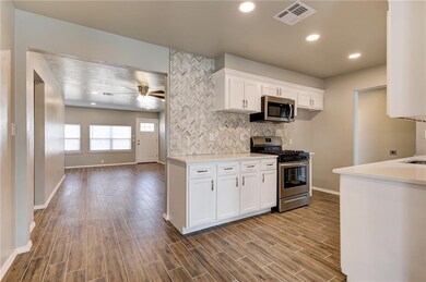 Kitchen - Wood Grain Tile, Quartz Counter Tops, Ne