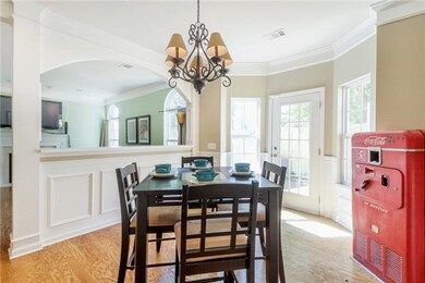 An open half-wall connects the dining area to the 