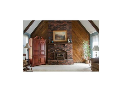 Stunning Great Room with vaulted ceiling, fan, woo