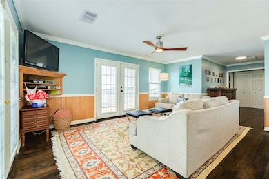 Living space with door to front deck.