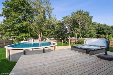 Backyard above ground pool, partial wrap around de